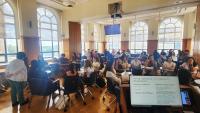 Students in small groups working on an activity during a CHEC event